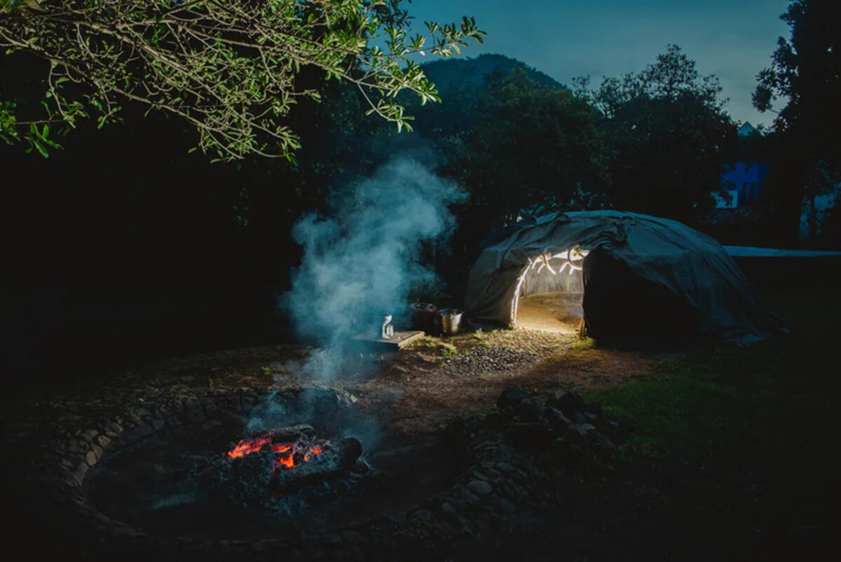 Temazcal sweat lodge glowing at night